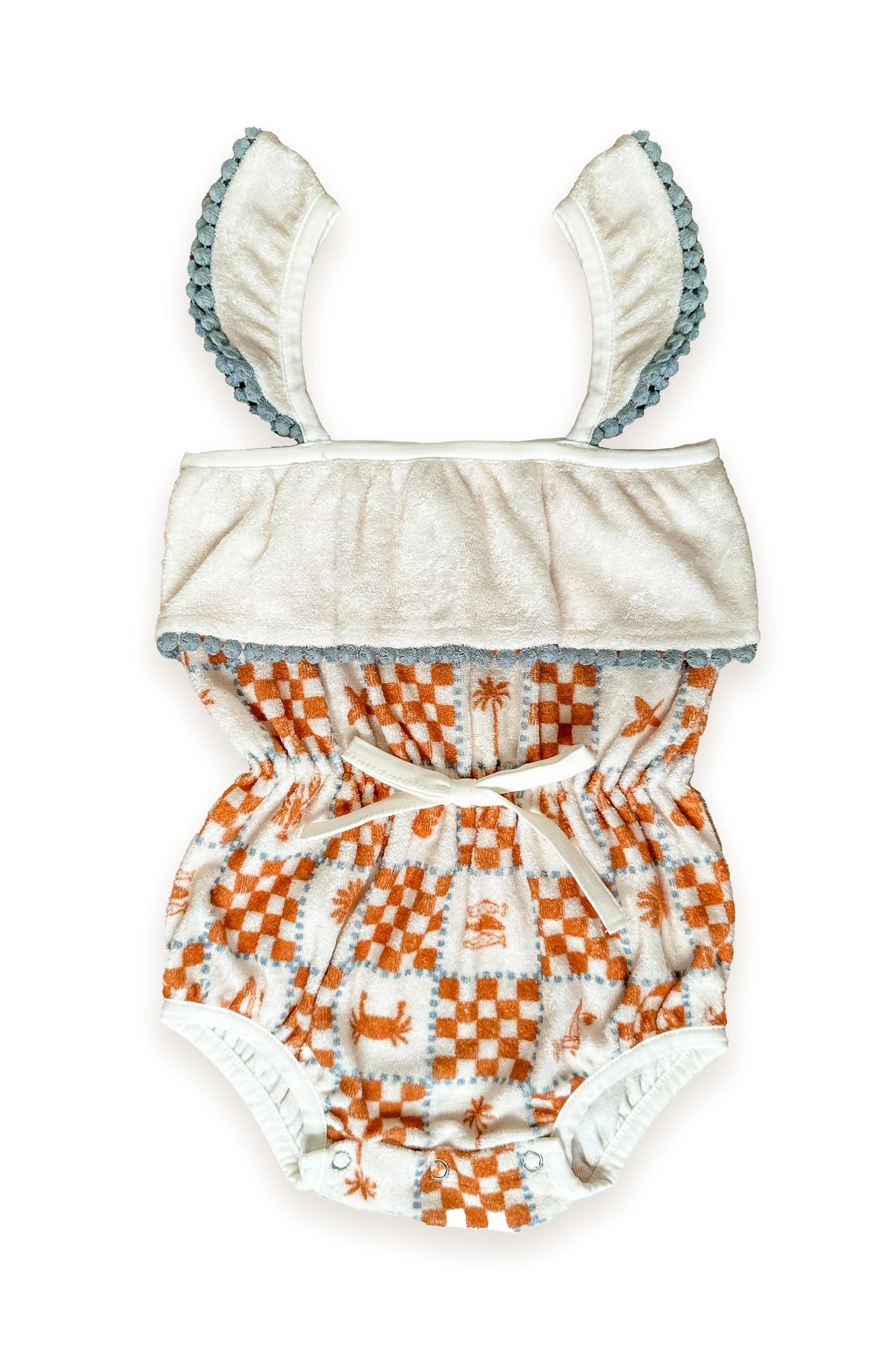 Miki Miette one-piece swimsuit with orange and white pattern on a white background