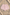 Miki Miette Pink and white striped shorts on a sandy surface with seashells.